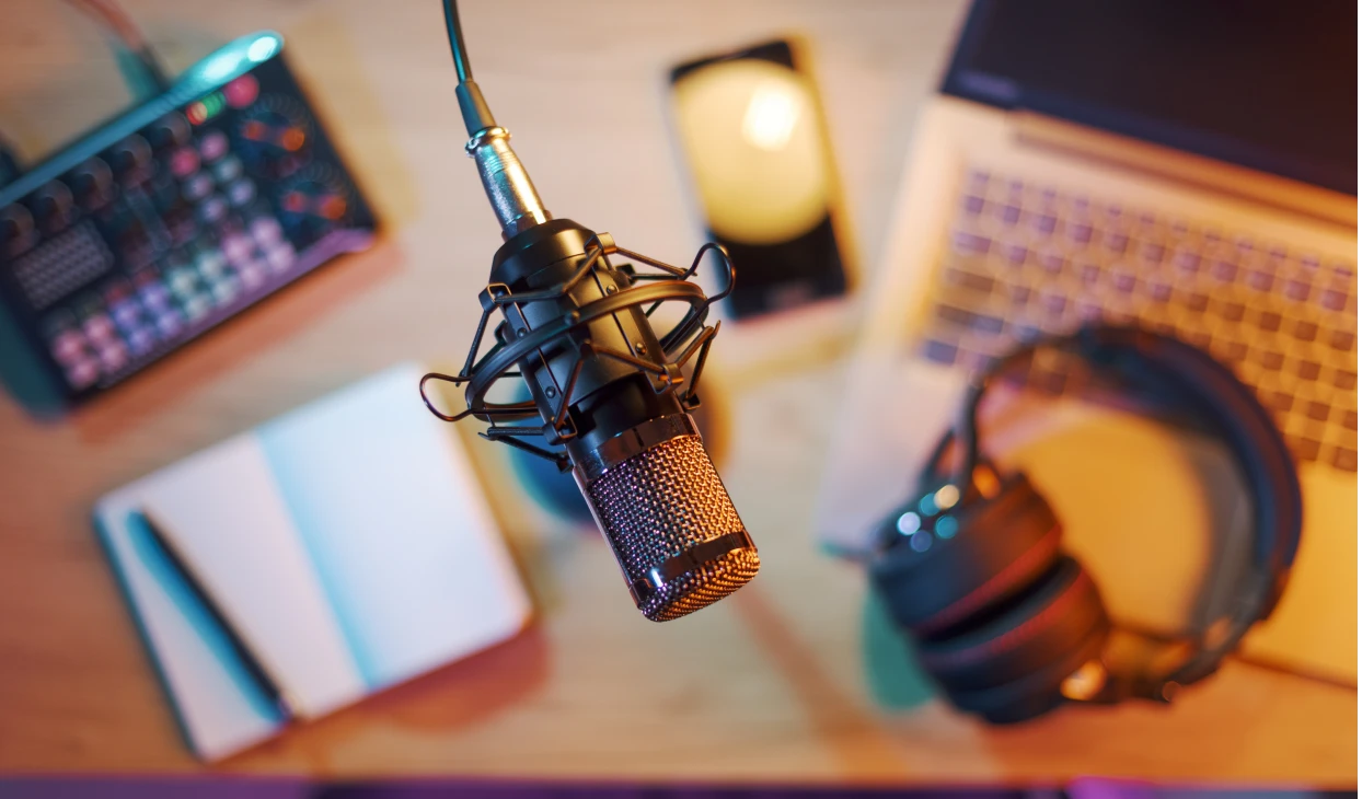 Microphone and headphones on a desk