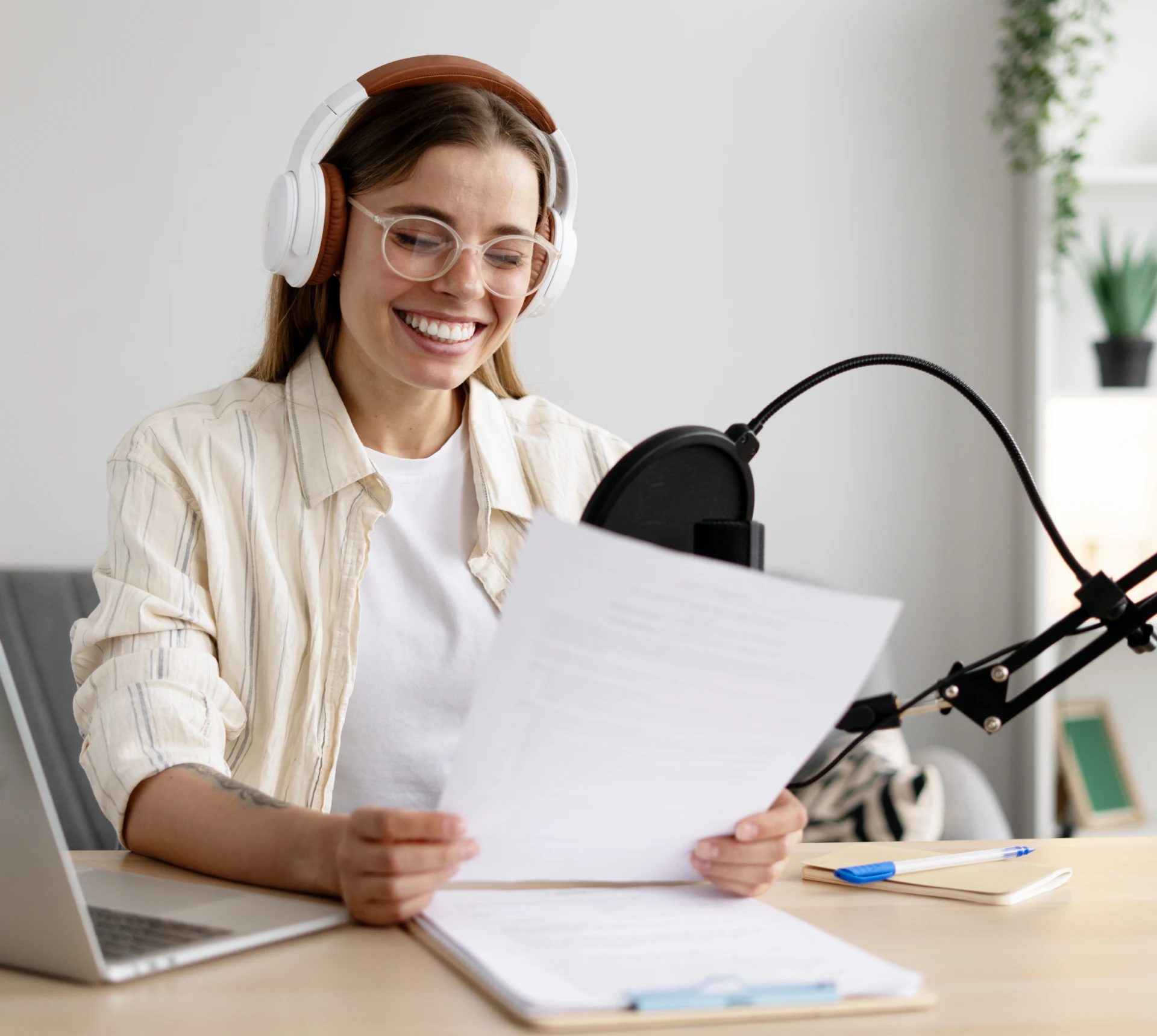 Smiling woman recording audio content