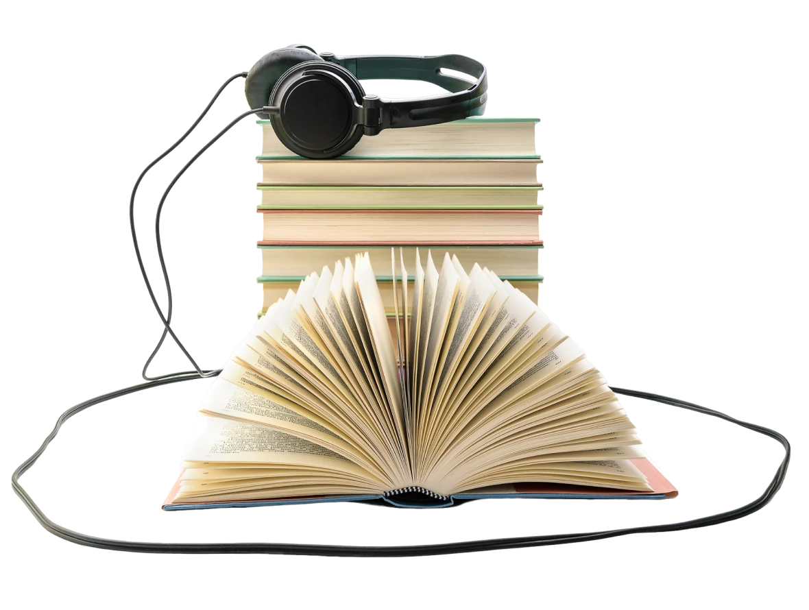 Stack of books, open book, headphones nearby